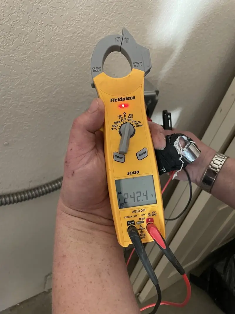 Voltage testing with clamp meter during Recessed Lighting Installation in Sweet Home